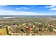 Scenic aerial shot showcasing a property nestled among trees, with a lake visible in the distance at 539 Villa Rosa Rd, Temple, GA 30179