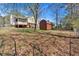 Expansive backyard with a screened-in porch, deck, and storage shed at 539 Villa Rosa Rd, Temple, GA 30179