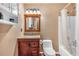 Bathroom featuring a shower and tub combo next to a vanity with built-in storage at 539 Villa Rosa Rd, Temple, GA 30179