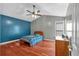 Bedroom featuring a ceiling fan, a closet, and hardwood floors at 539 Villa Rosa Rd, Temple, GA 30179