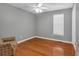 Bedroom featuring hardwood flooring, neutral gray walls, and a ceiling fan at 539 Villa Rosa Rd, Temple, GA 30179