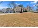 Charming two-story home with a two car garage and a grassy front yard at 539 Villa Rosa Rd, Temple, GA 30179