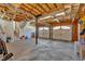 Spacious garage featuring two garage doors, a staircase, and overhead lighting at 539 Villa Rosa Rd, Temple, GA 30179