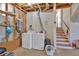 Functional laundry area with washer, dryer, and open shelving, perfect for efficient home management at 539 Villa Rosa Rd, Temple, GA 30179