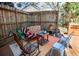 Charming backyard patio with comfortable seating, a wooden fence, and string lights for outdoor enjoyment at 959 Hampton Nw Trl, Lilburn, GA 30047