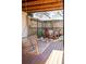 Cozy fenced backyard patio area with string lights and inviting swing, perfect for relaxing outdoors at 959 Hampton Nw Trl, Lilburn, GA 30047