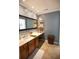 Spacious bathroom featuring a vanity with ample counter space and natural light at 959 Hampton Nw Trl, Lilburn, GA 30047