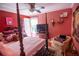 Well decorated bedroom featuring a four-poster bed, dresser and sitting chair at 959 Hampton Nw Trl, Lilburn, GA 30047