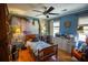 Cozy bedroom with a ship mural, vintage decor, and hardwood floors at 959 Hampton Nw Trl, Lilburn, GA 30047