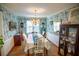 Formal dining room featuring patterned wallpaper, hardwood floors, and ample natural light at 959 Hampton Nw Trl, Lilburn, GA 30047