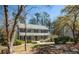 Charming two-story home with a welcoming front porch and a well-manicured lawn at 959 Hampton Nw Trl, Lilburn, GA 30047