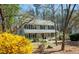 Inviting two-story home with a charming front porch and well-maintained landscaping at 959 Hampton Nw Trl, Lilburn, GA 30047