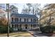Classic two-story home with a covered front porch and well-kept landscaping at 959 Hampton Nw Trl, Lilburn, GA 30047
