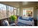 Relaxing screened-in porch with ample seating and views of a lush backyard at 959 Hampton Nw Trl, Lilburn, GA 30047