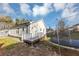 Exterior side and back view of this charming home with an inviting wooden deck and backyard trampoline at 2478 Verbena Nw Cir, Atlanta, GA 30314