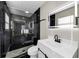 Elegant bathroom featuring black marble and sleek fixtures and hardware at 2478 Verbena Nw Cir, Atlanta, GA 30314