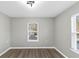 A bedroom with vinyl flooring and a double-hung window with blinds at 2478 Verbena Nw Cir, Atlanta, GA 30314