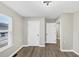 A bedroom with vinyl flooring, a double-hung window and a white door at 2478 Verbena Nw Cir, Atlanta, GA 30314