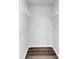Walk-in closet equipped with metal shelving and gray vinyl flooring at 2478 Verbena Nw Cir, Atlanta, GA 30314