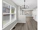Dining area with modern light fixture, hardwood floors and natural light at 2478 Verbena Nw Cir, Atlanta, GA 30314