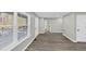 An open floorplan features hardwood flooring, neutral walls, and lots of light at 2478 Verbena Nw Cir, Atlanta, GA 30314