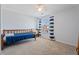 Bright bedroom with a bed, blue striped curtains, and a window that provides natural light at 2845 Englewood Dr, Cumming, GA 30040