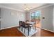 Dining area with a wooden table, pendant lighting, and access to the outdoor deck at 2845 Englewood Dr, Cumming, GA 30040