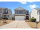 Charming two-story home featuring a two-car garage and a well-manicured front lawn at 2845 Englewood Dr, Cumming, GA 30040