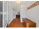 Inviting foyer with hardwood floors, a wooden storage cabinet, and a glimpse of the living area at 2845 Englewood Dr, Cumming, GA 30040