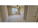 Comfortable bedroom featuring neutral paint and carpet with ample closet space at 4858 Westridge Dr, Norcross, GA 30093