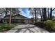 Inviting home with a brick facade, complemented by a well-manicured front lawn at 4858 Westridge Dr, Norcross, GA 30093
