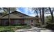 Charming brick and siding home with well-maintained landscaping and mature trees at 4858 Westridge Dr, Norcross, GA 30093
