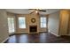 Spacious living room featuring a fireplace and ample natural light at 4858 Westridge Dr, Norcross, GA 30093