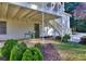 Under the porch of the house with stairs, plants, and a blue table at 684 Oak Moss Dr, Lawrenceville, GA 30043
