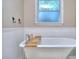 Relax in this clawfoot tub with a window view, complete with a convenient wooden shelf at 684 Oak Moss Dr, Lawrenceville, GA 30043