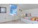 Bright bedroom with large window and daybed offering a cozy retreat at 684 Oak Moss Dr, Lawrenceville, GA 30043