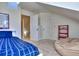 Cozy bedroom with a blue bedspread, beanbag chair, and a red bookshelf at 684 Oak Moss Dr, Lawrenceville, GA 30043