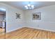 A traditional dining room offers beautiful hardwood floors and tasteful molding with neutral paint at 684 Oak Moss Dr, Lawrenceville, GA 30043