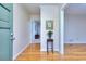 Inviting foyer boasts gleaming hardwood floors and natural light from the glass front door at 684 Oak Moss Dr, Lawrenceville, GA 30043