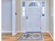 Bright foyer featuring hardwood floors, a white door and natural light from sidelights at 684 Oak Moss Dr, Lawrenceville, GA 30043