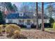 Charming single-story home featuring a well-maintained lawn and mature landscaping at 684 Oak Moss Dr, Lawrenceville, GA 30043