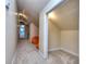 The neutral hallway features soft carpeting and clever built-in storage nooks, offering a cozy feel at 684 Oak Moss Dr, Lawrenceville, GA 30043