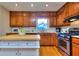 This cozy kitchen features a breakfast bar, stainless appliances and center island at 684 Oak Moss Dr, Lawrenceville, GA 30043