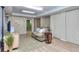The finished basement has a tan couch on a decorative rug with white trim and wood-look floors at 684 Oak Moss Dr, Lawrenceville, GA 30043