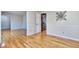 Bright and open living room featuring hardwood floors, light walls, and crown molding at 684 Oak Moss Dr, Lawrenceville, GA 30043