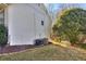 Side yard of the home with air conditioning units and room to relax outdoors at 684 Oak Moss Dr, Lawrenceville, GA 30043
