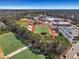 Expansive aerial view of the school's sports fields, including football, baseball, and soccer fields on a sunny day at 2620 Middle Coray Cir, Marietta, GA 30066