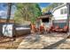 Inviting outdoor patio with hot tub, TV, seating and wooden accents, perfect for relaxation and entertainment at 2620 Middle Coray Cir, Marietta, GA 30066