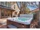 Backyard features a hot tub with exterior access from a patio and lush landscaping surrounding the yard at 2620 Middle Coray Cir, Marietta, GA 30066