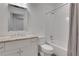 This bathroom features a white vanity with a stone countertop, a shower-tub combo, and white subway tile at 2620 Middle Coray Cir, Marietta, GA 30066